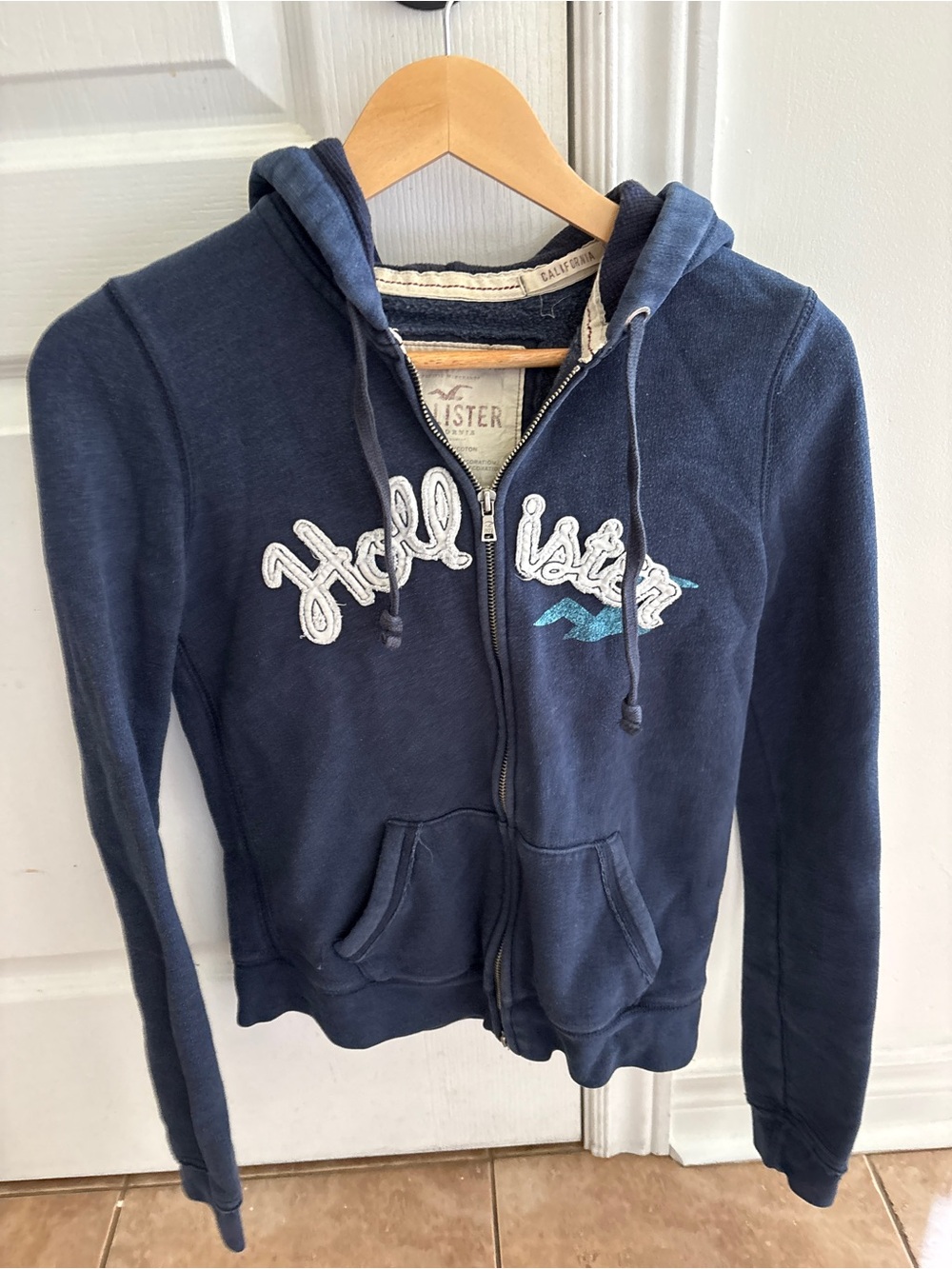 Hollister Women's Dark Navy Zip Hoodie with Embroidered Logo
